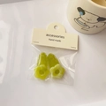 Detailed close-up of grass green flower-shaped hair clips in handmade cardboard packaging - Jelly Green