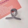 Detail view of large matte purple shark hair claw clip with cross spiral design - Cross Shape / Matte Grey