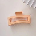 Close-up of a 13cm matte coral orange rectangular shark hair claw clip for thick hair - Cream Orange (Square Claw Clip Approx 13cm)
