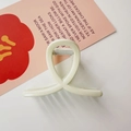 Detail view of a cream-white acrylic hair claw clip with a minimalist cross design - Cross Shape / Glossy White