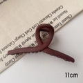 Detail view of 11cm matte reddish-brown hair claw clip with a twisted ring design - M / Matte Wine Red