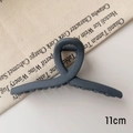 Detail view of 11cm matte greyish-blue shark hair claw clip with cross curved design - M / Matte Haze Blue
