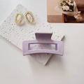 Detail of lavender purple matte hair claw clip with speckled texture on stone display - Sesame Point Purple
