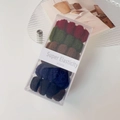 Detailed close-up of high-elasticity hair ties in assorted dark colors in a gift box - Mixed Color