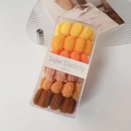 Close-up of seamless high elasticity hair ties set in a transparent storage box - Orange Series