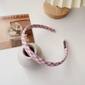 Detail of red and white gingham fabric headband with a black handmade label detail - Grid Pink