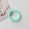 Detail of mint green spiral telephone wire hair tie with high elastic TPU material - Mint Green