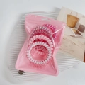 Pink spiral hair ties set with heart and flower patterns in a translucent zipper pouch - Pink