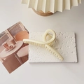 Macro detail of large cream shark hair claw clip on stone textured background - L / Glossy White