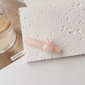 Close-up of pink marble-textured acetate hair clip with a cute bunny head decoration - Pink