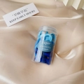 Detail of blue elastic hair ties in a transparent storage jar with a lid - Jar Blue