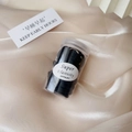 Jar of high-elastic black hair ties on beige silk with decorative lifestyle elements - Jar Black