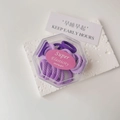 Detail of purple elastic hair ties set in a hexagonal box with high elasticity labels - Boxed Purple