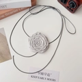 Macro detail of handmade light gray fabric rose choker with delicate petal texture - Silver Gray