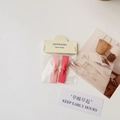 Set of two pink and red bow hair clips with camellia detail on white background - Girlish Pink Bowknot