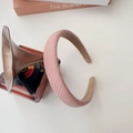 Pink woven padded headband with anti-slip lining shown next to retro props on white background - Grid Headband-Pink