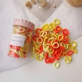 Colorful elastic hair ties for girls stored in a transparent jar with striped lid - Orange Yellow Ice Cream Cup
