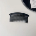 Detail view of a black 22-teeth hair side comb with a matte finish and curved design - Plain Hair Comb - Black