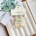 Gradient green and yellow fish-shaped hair clips in professional retail packaging - Little Fish Green Tail