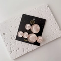 Detail of pink resin hair clips with ripple texture on white stone decorative stand - One Pair / Light Pink