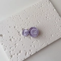 Detailed macro of purple circular resin hair clips with elegant spiral ripple texture - Single Piece / Small / Purple