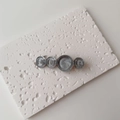Detail of grey resin marble pattern circles on a golden metal hair clip for women - Single Piece / Large / Gray