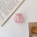 Detail of pink jelly pumpkin hair claw clip made of durable translucent plastic material - Transparent Pink