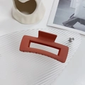 Matte brick red rectangular hair claw clip with hollow geometric design on decorative tray - Square Orange-10.5cm