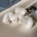 Detail view of a 14cm large white plush shark clip with soft faux fur and wave design - M-Shape Hair Claw / White