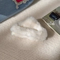 Macro detail of a 11cm white plush hair claw clip on a textured knit background - Triangle / White