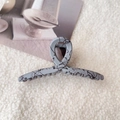 Detail of matte grey shark hair claw with black ink splatter texture on soft fabric - Medium - Grey