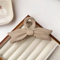 Elegant matte apricot bow hair claw clip with frosted texture for sophisticated styling - Khaki