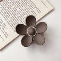 Close-up of matte chocolate brown flower hair claw clip with central rhinestone detail - Rhinestone Coffee