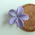Purple flower hair claw clip with matte finish on a woven mat for women's hair styling - Gradient Purple Matte
