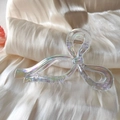 Detail of holographic butterfly hair claw clip with golden metal spring on beige silk - White (AB Color)