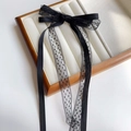 Close-up of black lace ribbon hair clip with polka dot mesh and double-sided satin bow - Black-Duckbill Clip