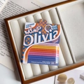 Detailed view of 10 candy-colored high-elastic hair ties on a branded display card - Orange Sunset