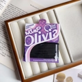 Close-up of 10-piece high elasticity black hair ties in premium paper packaging - Solid Black