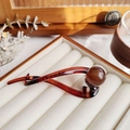 Elegant amber brown twisted banana hair clip with a smooth resin finish and round bead - Amber (Full Pearl)
