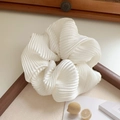 Detail of white pleated silk-like scrunchie featuring elegant vintage French ruffles - White