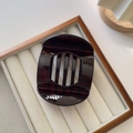 Detailed view of large retro tortoiseshell hair claw clip with non-slip hollow design - Large / Dark Coffee