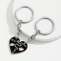 Pair of BEST FRIENDS puzzle heart keychains with black enamel and pink heart detail - Patchwork Heart Style / Black And Silver Patchwork