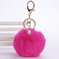 Detail of soft rose red faux fur keychain with a gold clasp and sparkling crystal ball - 8cm Pompom / Rose Red