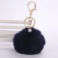 Detail of navy blue faux rabbit fur pompom keychain with sparkling rhinestone ball and gold clip - 8cm Pompom / Navy Blue
