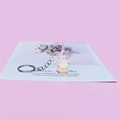 Detail of pink miniature fruit tea cup keychain with lemon slice and striped straw - Yellow