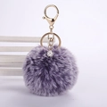 Detail of lavender faux rabbit fur pom pom keychain with gold lobster clasp and crystal ball - 8cm Pompom / Two-tone Purple