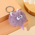 Close-up of purple plush ice cream keychain with fuzzy texture and cute large eye detail - Purple