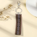 Detail of ethnic geometric woven strap keychain with silver metal lobster clasp and ring - Style A