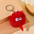 Close-up of red plush ice cream keychain with fuzzy fur texture and silver metal ring - Red