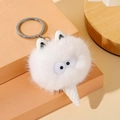 Dettaglio portachiavi mostro di peluche bianco con grandi occhi e base a cono gelato - Bianco